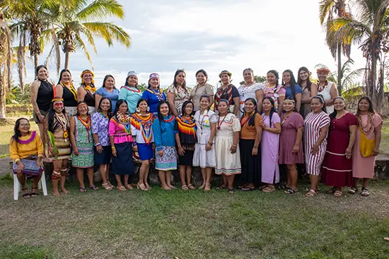 Group photo of Indigenous women ministry leaders gathering outdoors.